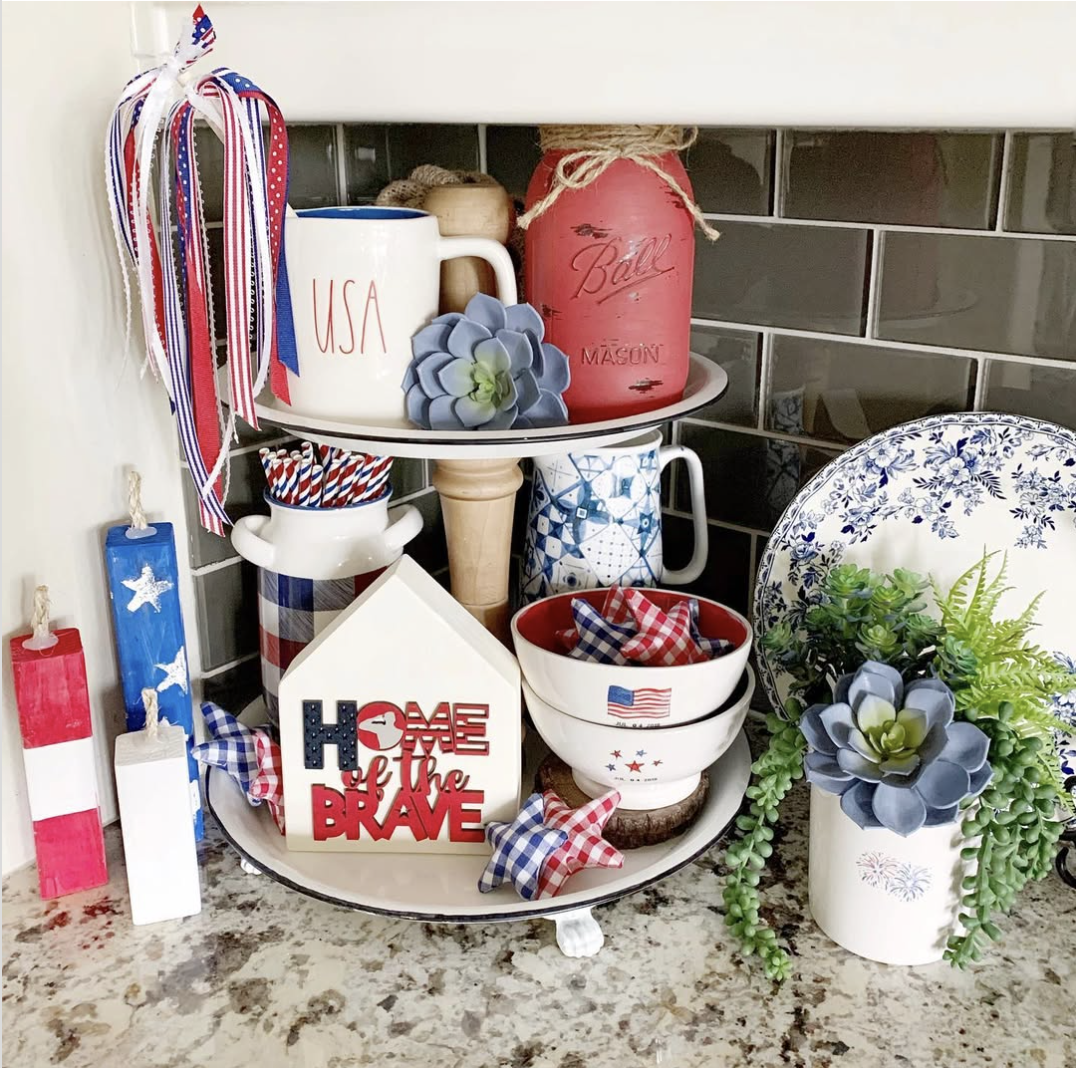 Soft and simple 4th of July tray with gingham napkins, USA mug, red mason jar, patriotic blocks, and mini succulents.
