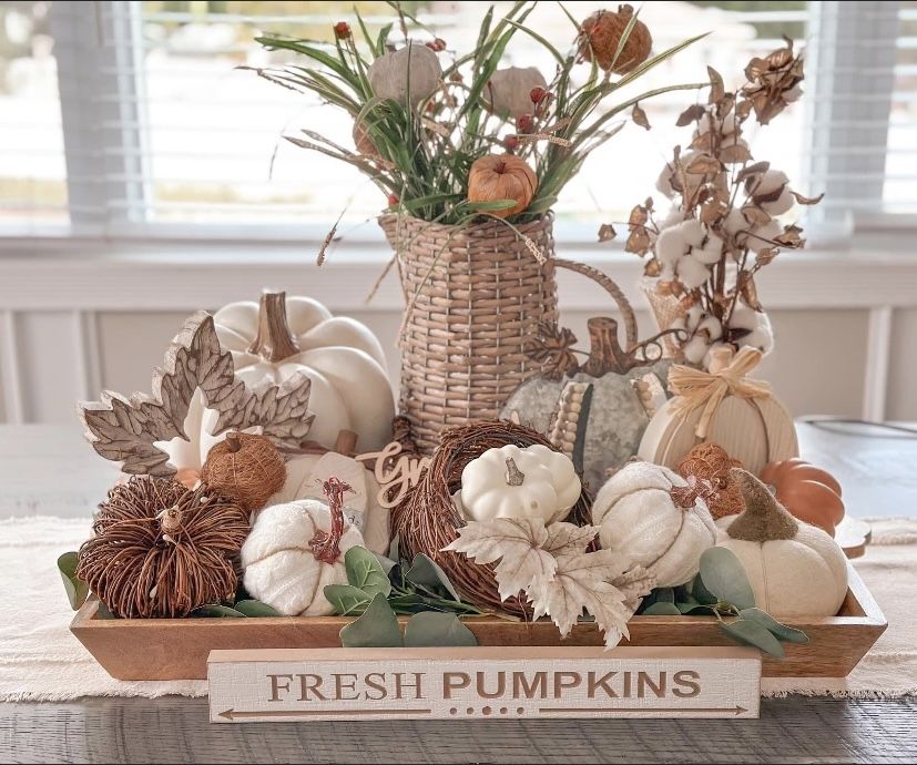Cream and white fall dough bowl with a fresh pumpkins sign, white and grapevine pumpkins, cotton stems, and a woven basket riser.