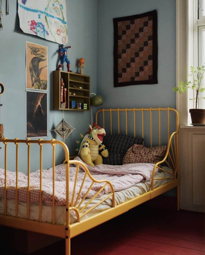 Small kids bedroom with a bold yellow metal bed frame